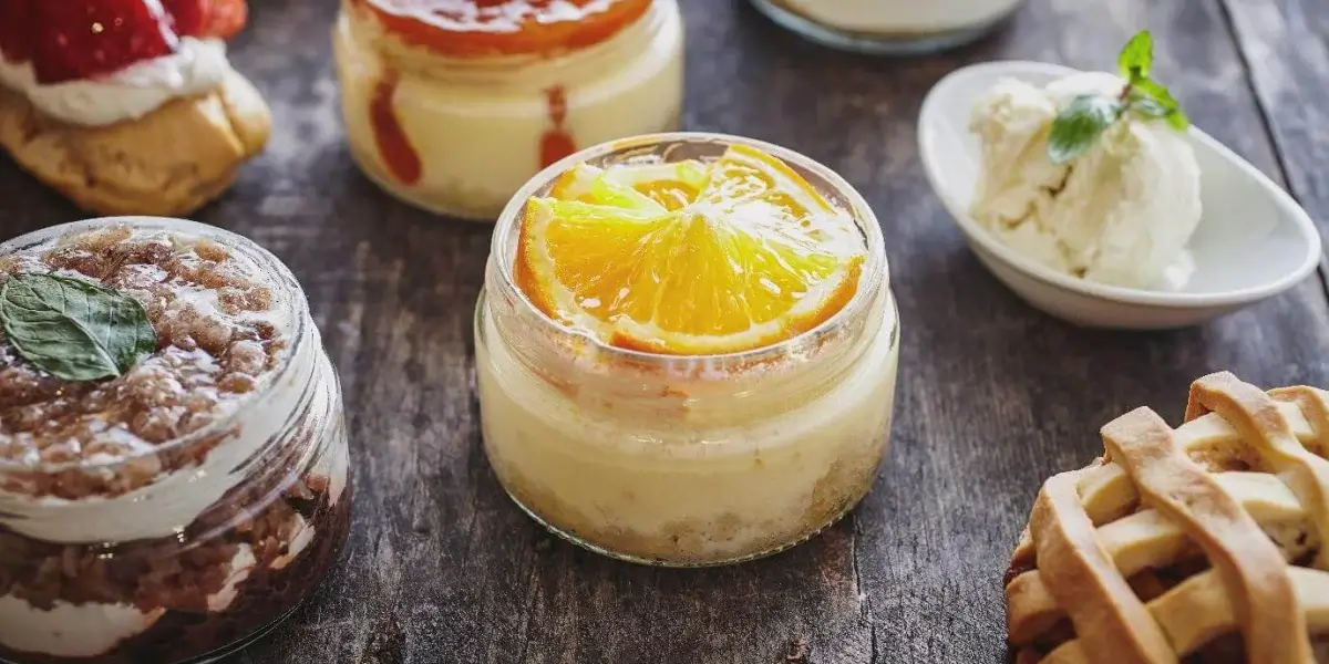 Assortment of puddings in glass jars